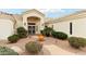 Inviting front entrance showcasing a decorative fountain and lush, desert landscaping at 6460 E Trailridge Cir # 2, Mesa, AZ 85215