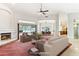 Bright living room with a fireplace, lots of natural light, and an open floor plan for easy entertaining at 6460 E Trailridge Cir # 2, Mesa, AZ 85215