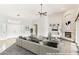 Inviting living room featuring a fireplace, vaulted ceiling, bright lighting, and seamless indoor-outdoor living at 6460 E Trailridge Cir # 2, Mesa, AZ 85215