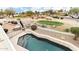 The elevated backyard pool overlooks the neighborhood with views of a golf course at 6460 E Trailridge Cir # 2, Mesa, AZ 85215