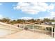 A white metal railing surrounds a roof deck, and it overlooks a verdant golf course at 6460 E Trailridge Cir # 2, Mesa, AZ 85215