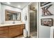 Well-lit bathroom featuring a vanity with a sink and a shower, designed for convenience at 6533 N 7Th Ave # 22, Phoenix, AZ 85013