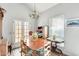 Bright dining area with hardwood table and chairs, plus a stylish chandelier at 6533 N 7Th Ave # 22, Phoenix, AZ 85013