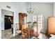 Light-filled dining room with a view to the kitchen and an exterior exit at 6533 N 7Th Ave # 22, Phoenix, AZ 85013