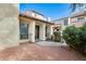 Charming townhome featuring a red tile roof, private entrance, and desert landscaping at 6533 N 7Th Ave # 22, Phoenix, AZ 85013