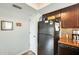 Spacious kitchen featuring a refrigerator and overhead storage at 6533 N 7Th Ave # 22, Phoenix, AZ 85013