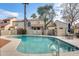 Community pool area surrounded by lush landscaping and comfortable seating, perfect for leisure at 6533 N 7Th Ave # 22, Phoenix, AZ 85013