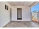 Covered patio with cement floors and white walls at 7113 E Bell Cir, Mesa, AZ 85208