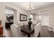 This dining room features wood floors, neutral walls, and access to the kitchen and other living spaces at 7337 S Debra Dr, Gilbert, AZ 85298