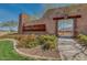 Community entrance sign featuring stone columns and beautiful landscaping along a sidewalk path at 7337 S Debra Dr, Gilbert, AZ 85298