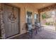 Inviting front porch with stone accents, brick paving, and cozy seating, perfect for relaxing outdoors at 7337 S Debra Dr, Gilbert, AZ 85298