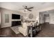 Spacious living room features modern furnishings, a ceiling fan, and seamless transition to the outdoors at 7337 S Debra Dr, Gilbert, AZ 85298