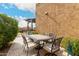 Outdoor dining area features a metal table with seating for six under a pergola at 7337 S Debra Dr, Gilbert, AZ 85298