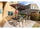 Outdoor kitchen area with grill, bar seating, and decorative accents under a pergola at 7337 S Debra Dr, Gilbert, AZ 85298