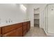 A spacious bathroom features double sinks, tiled shower and tile floors at 742 E Watermelon Ln, Queen Creek, AZ 85140