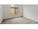 Cozy bedroom with neutral carpet and a bright window at 742 E Watermelon Ln, Queen Creek, AZ 85140