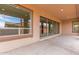 Expansive covered patio with multiple glass doors offering seamless indoor-outdoor living at 742 E Watermelon Ln, Queen Creek, AZ 85140