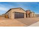 Beautiful single-story home featuring a brick-accented facade and a two-car garage at 742 E Watermelon Ln, Queen Creek, AZ 85140