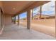 An outdoor covered patio with decorative columns overlooks the backyard and block wall at 742 E Watermelon Ln, Queen Creek, AZ 85140