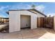 A backyard shed or covered patio area is visible in the back of the house at 7458 E Clovis Cir, Mesa, AZ 85208