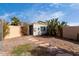 Backyard with a small storage shed, desert landscaping, and a cactus at 7458 E Clovis Cir, Mesa, AZ 85208