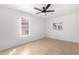 This bedroom includes tile flooring and a ceiling fan at 7458 E Clovis Cir, Mesa, AZ 85208