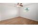 Bedroom with hard wood flooring, a window, and a ceiling fan at 7458 E Clovis Cir, Mesa, AZ 85208