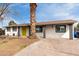 A white painted home featuring a bright yellow front door with good looking pillars at front at 7458 E Clovis Cir, Mesa, AZ 85208