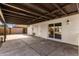 This covered patio has a concrete floor and provides shade and privacy at 7458 E Clovis Cir, Mesa, AZ 85208