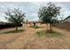 Expansive backyard with mature trees providing shade, perfect for outdoor activities at 8610 N 37Th Ave, Phoenix, AZ 85051