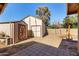 The backyard has two storage sheds and an open dirt area with pavers at 8612 N 31St Ln, Phoenix, AZ 85051