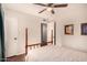 Well-lit bedroom features a classic wooden bed frame and a ceiling fan at 8612 N 31St Ln, Phoenix, AZ 85051