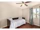 This bedroom features a ceiling fan, window with curtains, and a daybed with stylish patterned bedding at 8612 N 31St Ln, Phoenix, AZ 85051