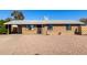 Inviting single-story brick home featuring neutral rock landscaping, a covered carport, and a welcoming entrance at 8612 N 31St Ln, Phoenix, AZ 85051