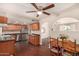 Eat-in kitchen featuring stainless steel appliances, wooden cabinets, and a ceiling fan at 8612 N 31St Ln, Phoenix, AZ 85051