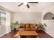 Inviting living room with wood floors, a ceiling fan, and natural light coming in from the windows at 8612 N 31St Ln, Phoenix, AZ 85051