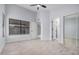 A bedroom with a ceiling fan, light colored wood look floors, and a large closet at 8826 W Amelia Ave, Phoenix, AZ 85037