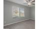 A bedroom with a ceiling fan and a window with views of the outdoors at 9734 W Carol Ave, Peoria, AZ 85345