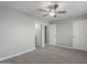 A bedroom with gray walls and a ceiling fan at 9734 W Carol Ave, Peoria, AZ 85345