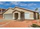 Single-story home with a large garage and desert landscaping at 9734 W Carol Ave, Peoria, AZ 85345