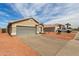 This home has a desert landscape and large driveway at 9734 W Carol Ave, Peoria, AZ 85345