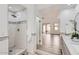 Elegant bathroom featuring a walk-in shower and a marble vanity at 10243 N 103Rd St, Scottsdale, AZ 85258