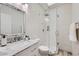 Elegant bathroom featuring marble countertop, glass shower and white tile surround at 10243 N 103Rd St, Scottsdale, AZ 85258