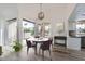 Elegant dining area with hardwood floors, sliding doors, and a stylish table with four chairs at 10243 N 103Rd St, Scottsdale, AZ 85258