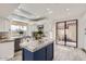 Bright kitchen with granite counters, stainless appliances and a blue island with bar seating at 10243 N 103Rd St, Scottsdale, AZ 85258