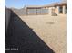 A long fenced backyard with gravel throughout at 1061 W Palo Verde Ave, Coolidge, AZ 85128