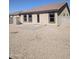 A gravel backyard with tan stucco walls and tile roof at 1061 W Palo Verde Ave, Coolidge, AZ 85128