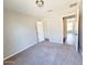 Neutral bedroom with a walk-in closet and carpet flooring at 1061 W Palo Verde Ave, Coolidge, AZ 85128