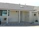 Inviting front entrance of the home with covered porch and a lovely seating area at 10612 N 102Nd Dr, Sun City, AZ 85351