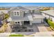 Aerial view of a home showcasing its roof, landscaping, and paved driveway at 10635 E Tesla Ave, Mesa, AZ 85212